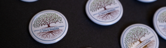 Office of Black Student Development Tree of Life logo on circle buttons